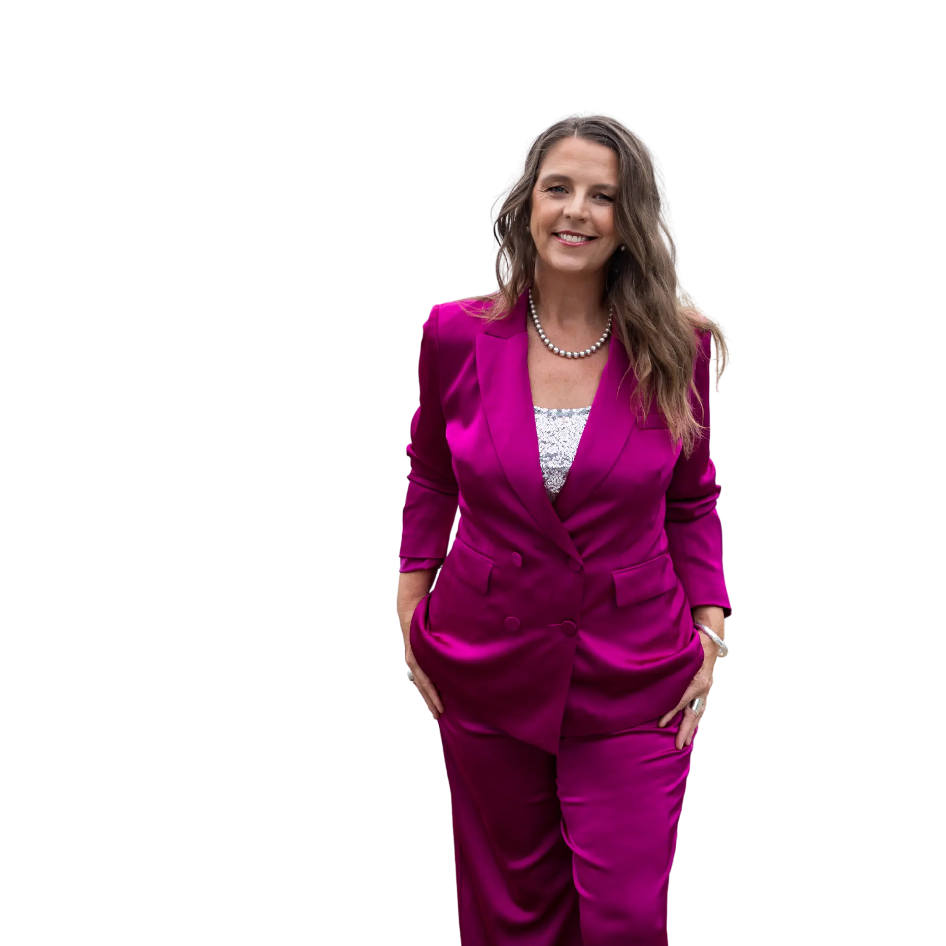 Kelly Kingston, founder of Women Of Wisdom, in a magenta suit